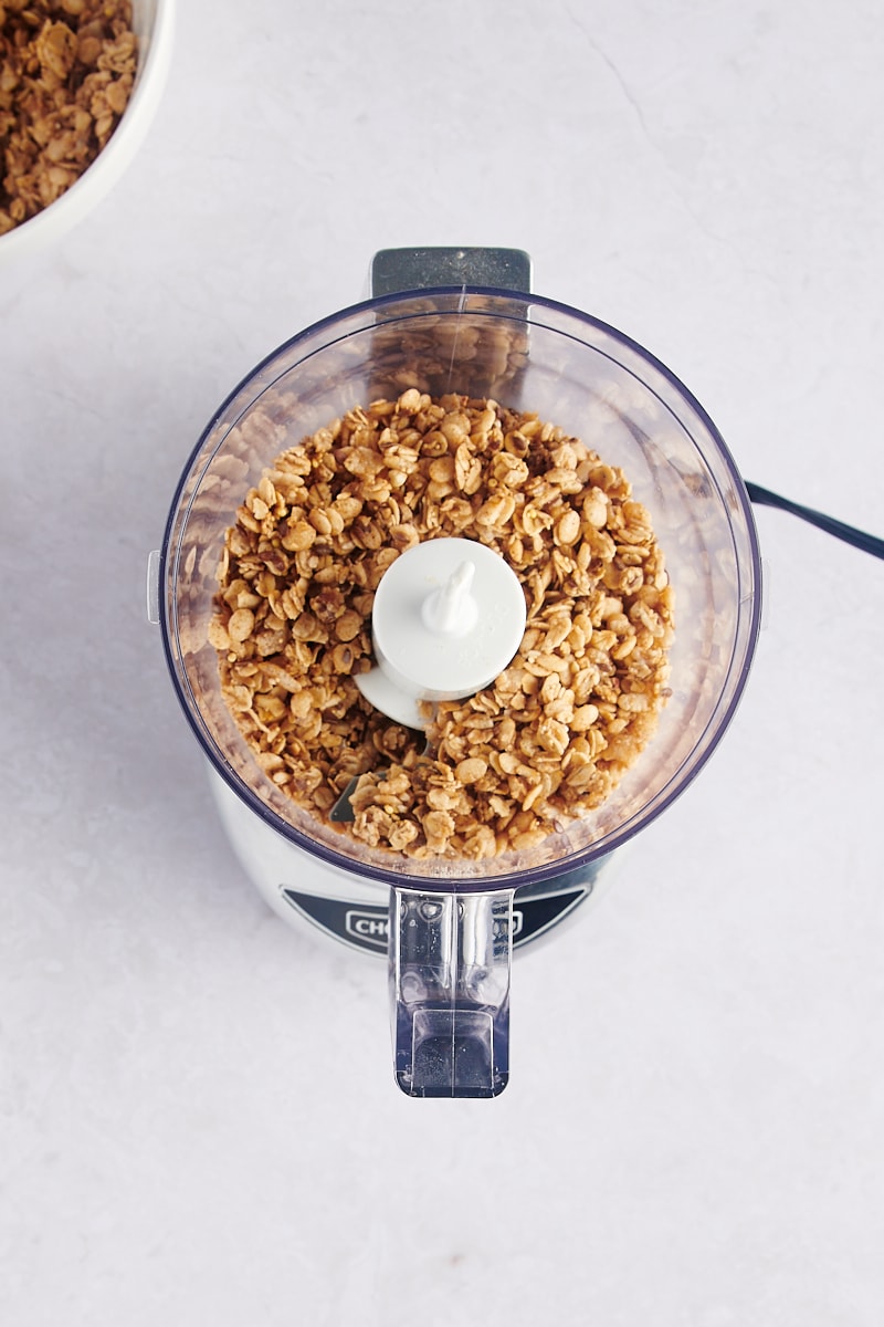 Overhead view of granola in food processor before grinding