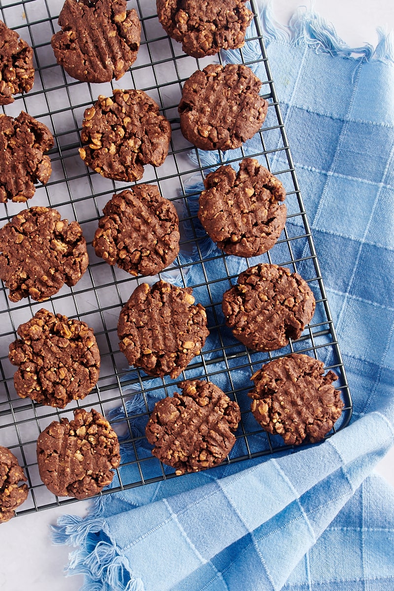 Overhead view of chocolate peanut butter granola cookies on cooling rack