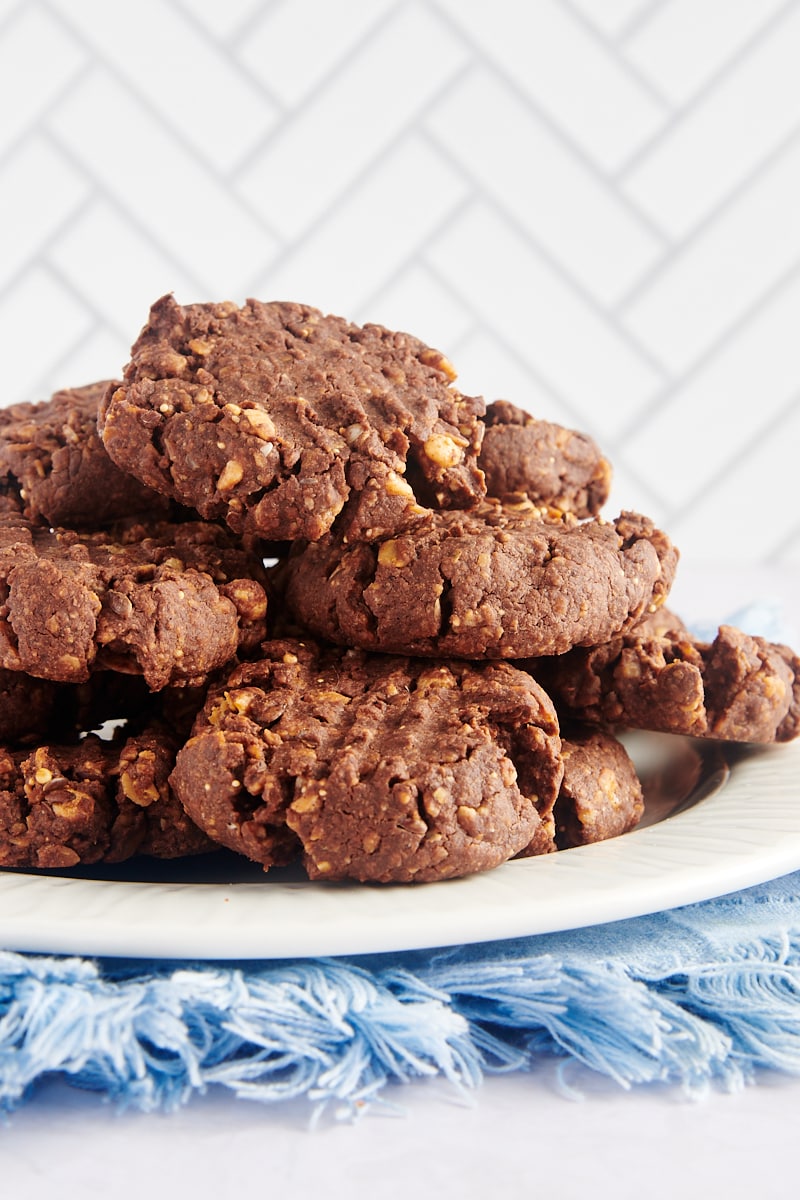 Chocolate peanut butter granola cookies stacked on plate