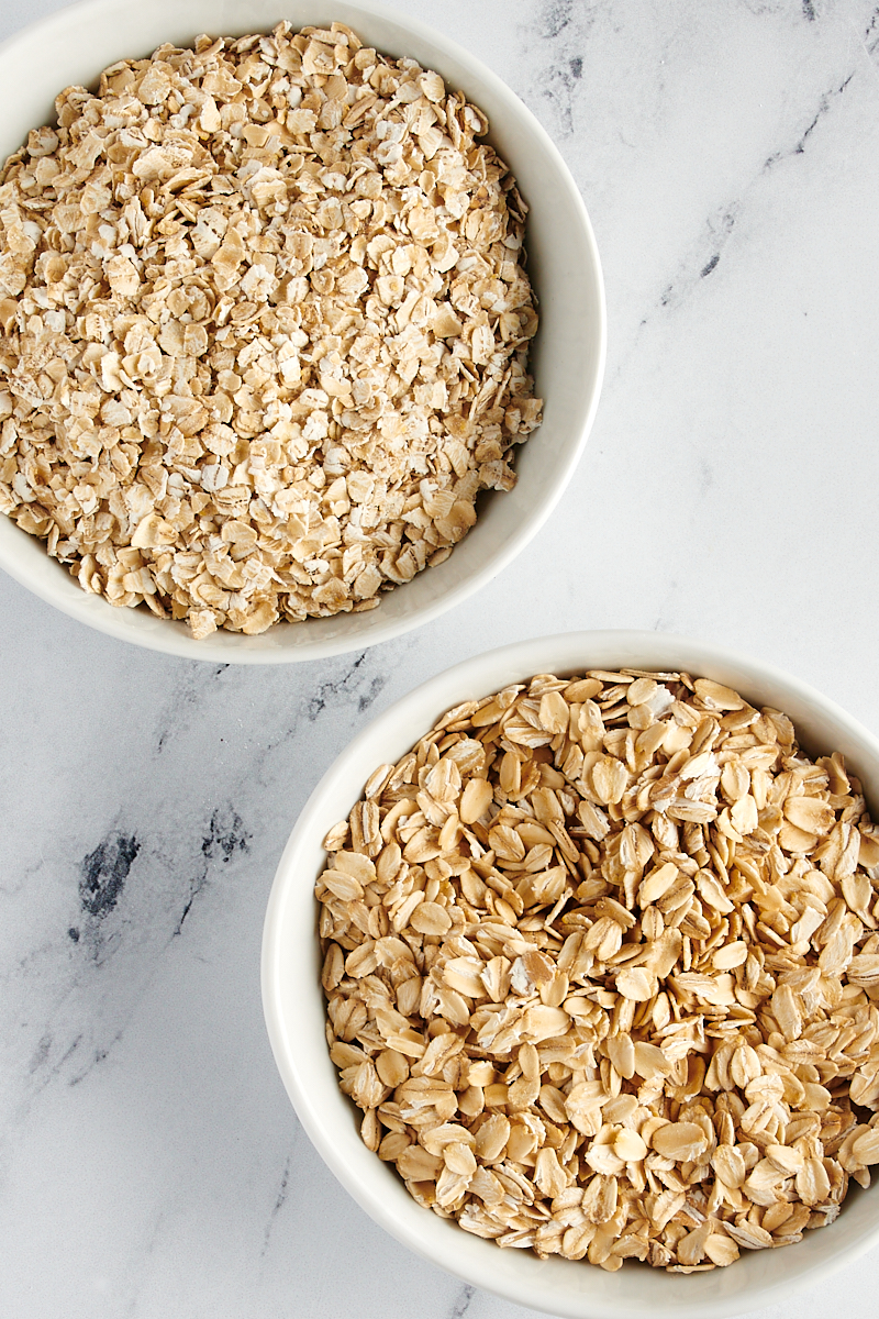 overhead view of a bowl of rolled oats and a bowl of quick oats