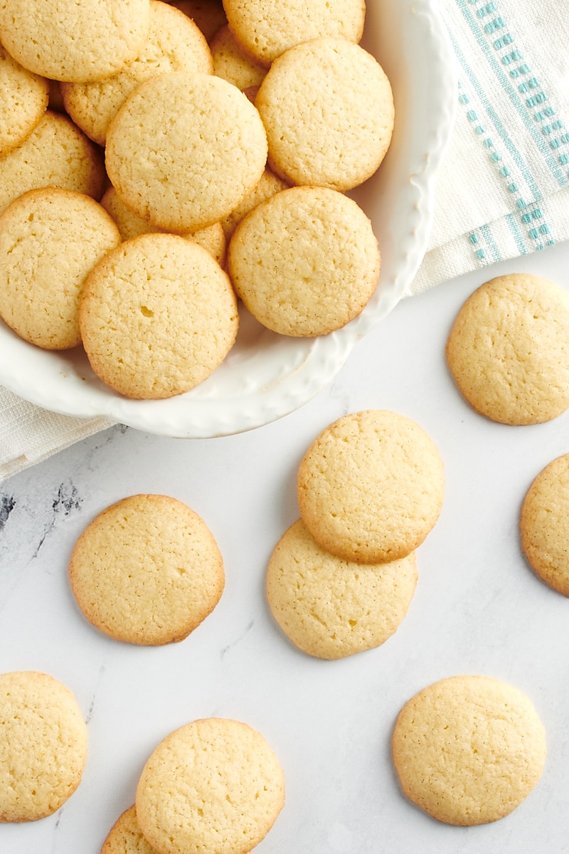 Overhead view of vanilla wafers on a countertop and a platter.