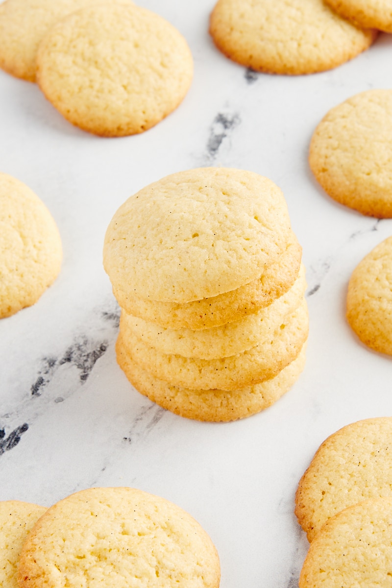 Stack of homemade vanilla wafers on a marble countertop.