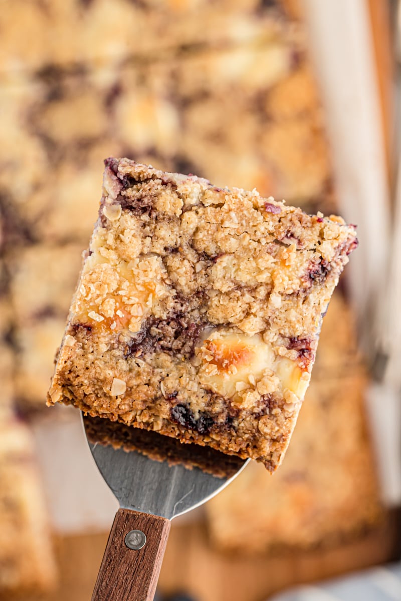 Blueberry jam cream cheese bar on spatula