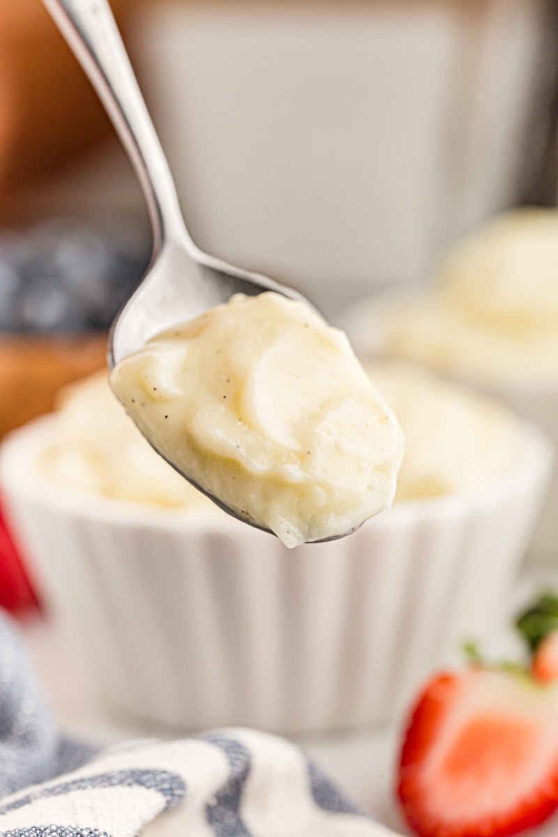 This homemade vanilla pudding is richer and creamier than anything from a box! Serve it as-is, with toppings, or use it in more desserts. Spoonful of homemade vanilla pudding with flecks of vanilla bean