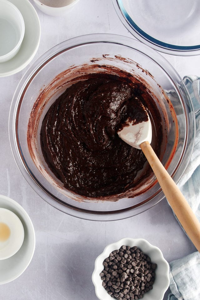 Overhead view of brownie brittle batter in glass mixing bowl