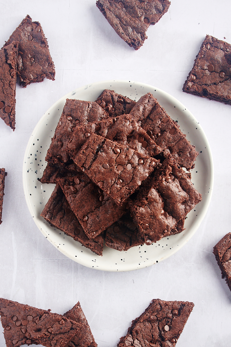 Overhead view of brownie brittle on countertop and stacked on plate