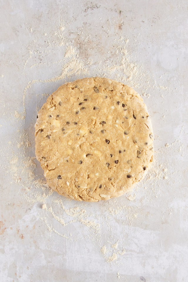 Overhead view of chocolate chip-hazelnut scone dough before cutting