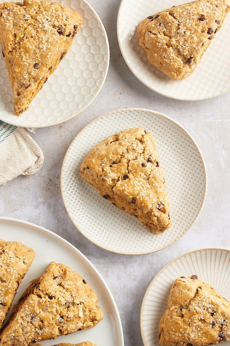 Overhead view of chocolate chip-hazelnut scones on plates