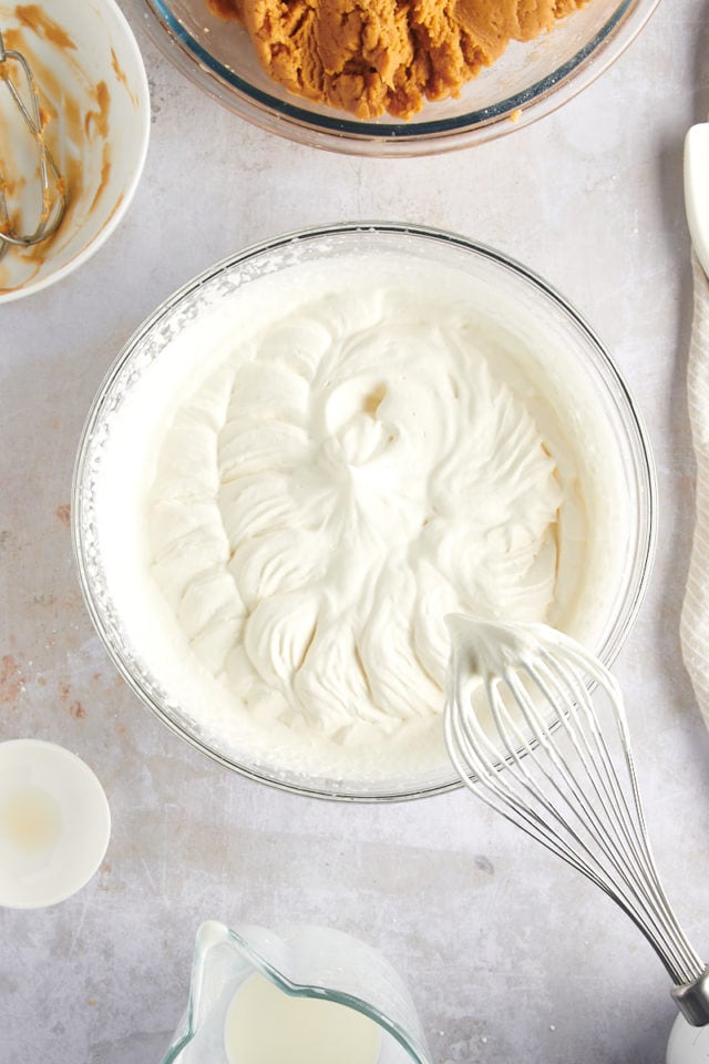 overhead view of whipped cream in a glass bowl