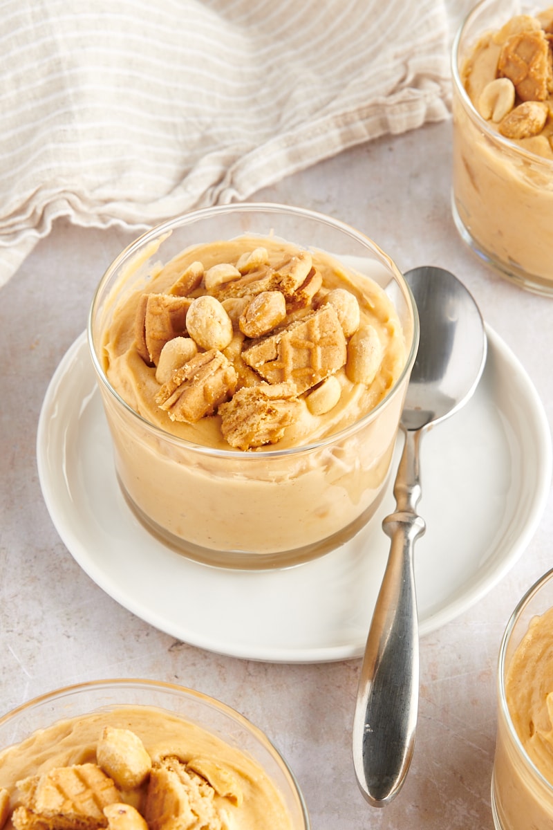 a serving of Peanut Butter Mousse in a glass on a white plate