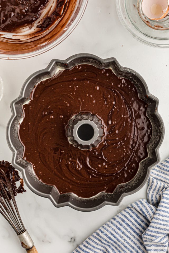 Overhead view of chocolate cake batter in Bundt pan