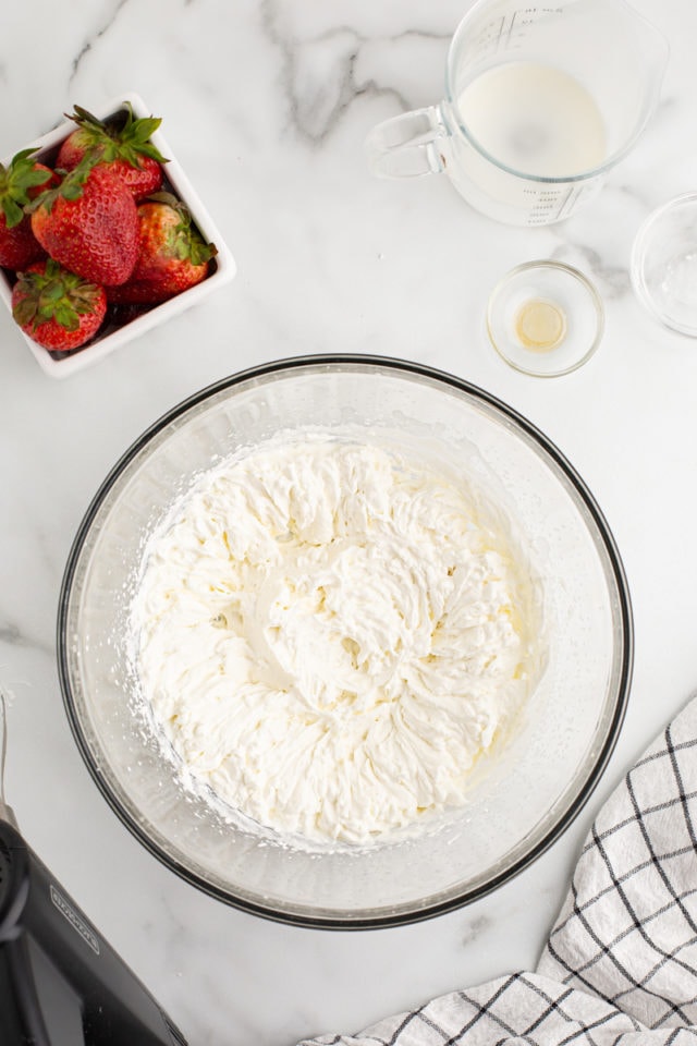 Overhead view of whipped cream in mixing bowl