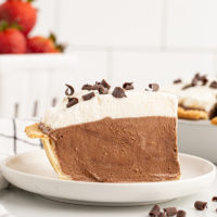 Side view of French silk pie on plate to show height and layers