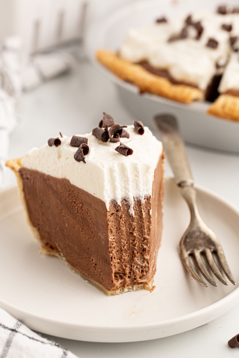French silk pie slice on plate with tip eaten