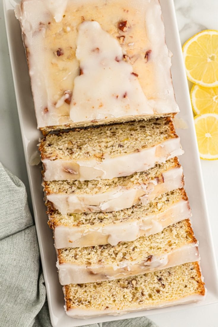 Overhead view of sliced lemon bread on serving tray