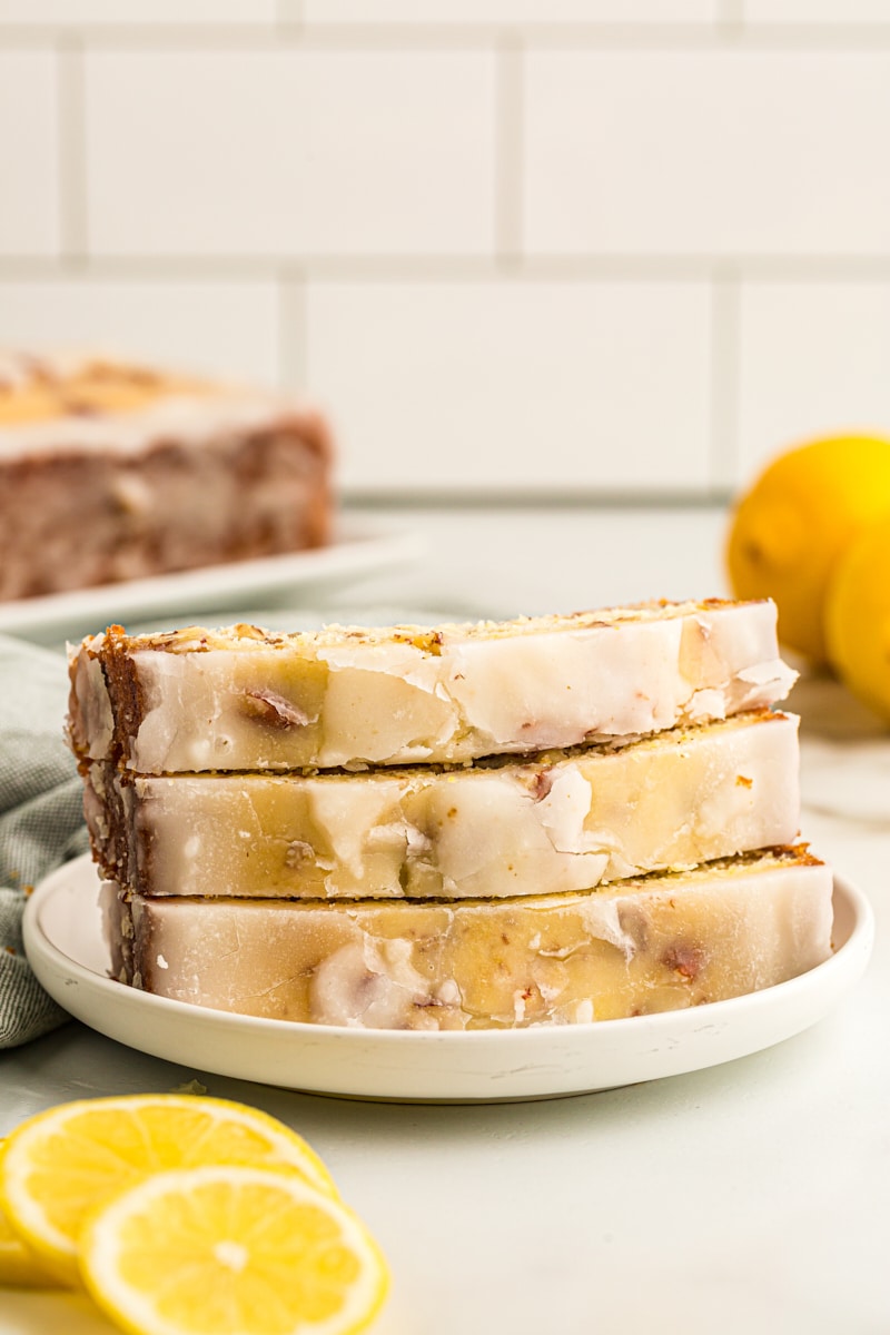 3 slices of lemon bread stacked on plate