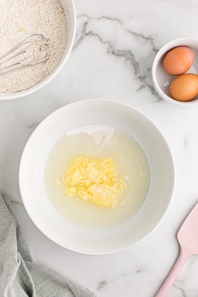 Overhead view of wet ingredients in mixing bowl before mixing