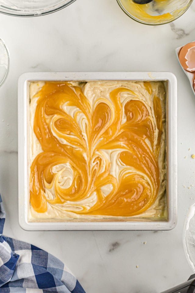 Overhead view of swirled lemon curd in cake batter
