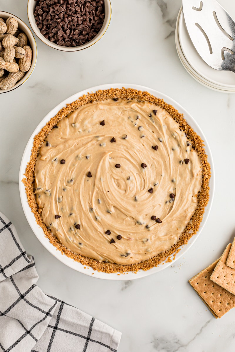 Overhead view of whole peanut butter chocolate chip pie before chilling