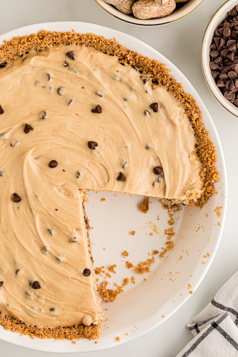 Overhead view of peanut butter chocolate chip pie with two slices removed