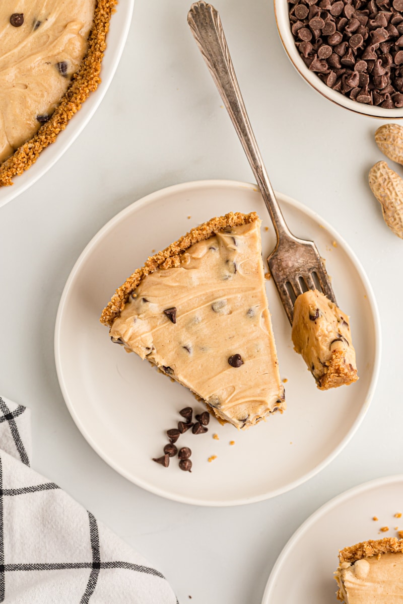 Overhead view of peanut butter chocolate chip pie on plate with tip on fork