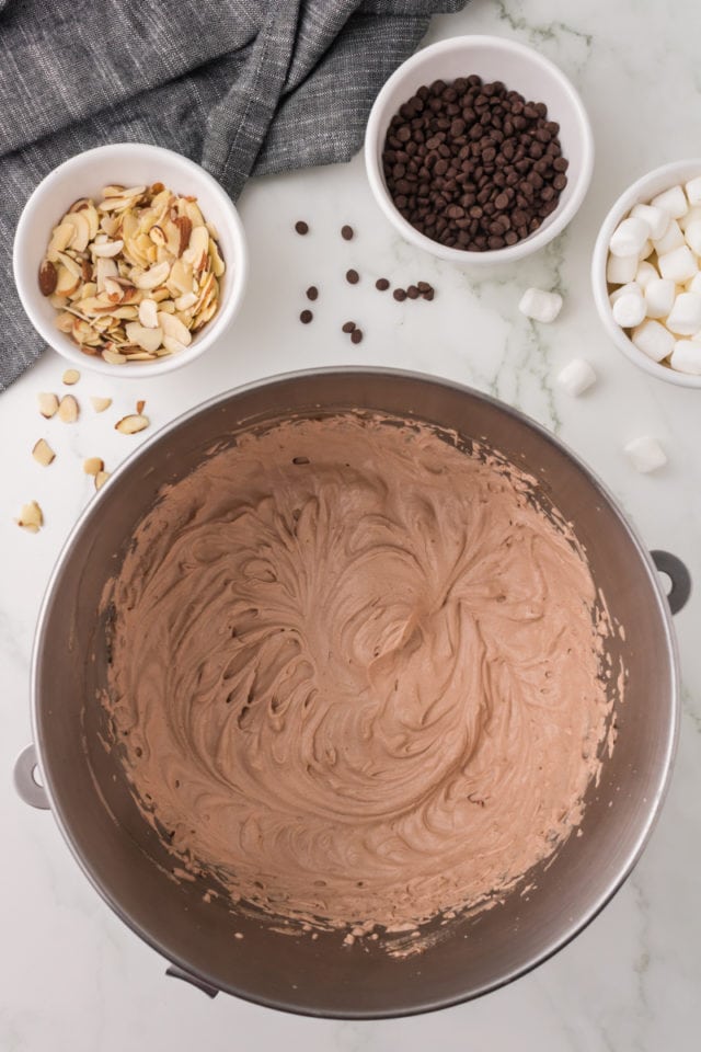 overhead view of chocolate ice cream base in a metal mixing bowl