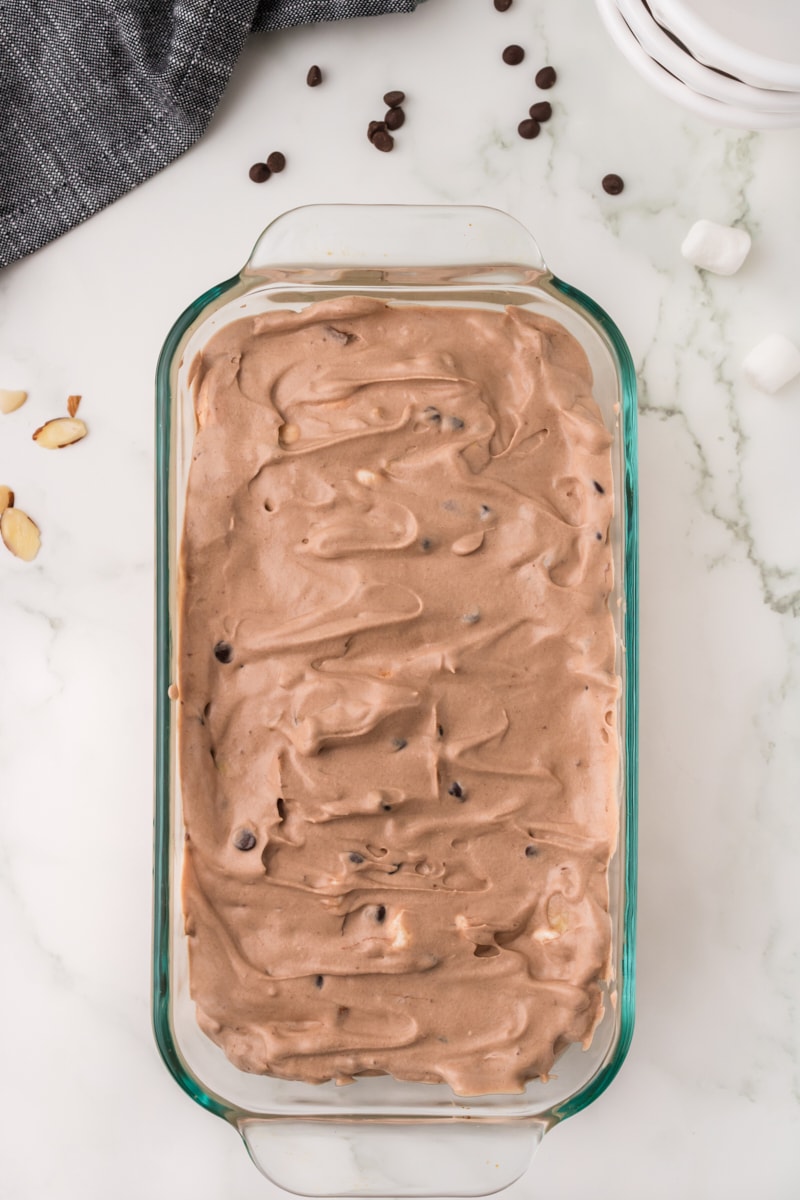 overhead view of rocky road ice cream in a glass pan 