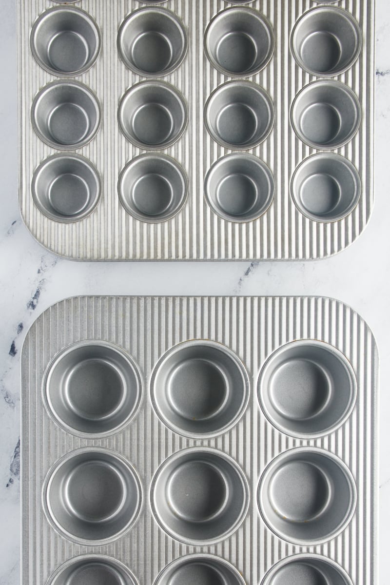 overhead view of a standard muffin pan and a mini muffin pan