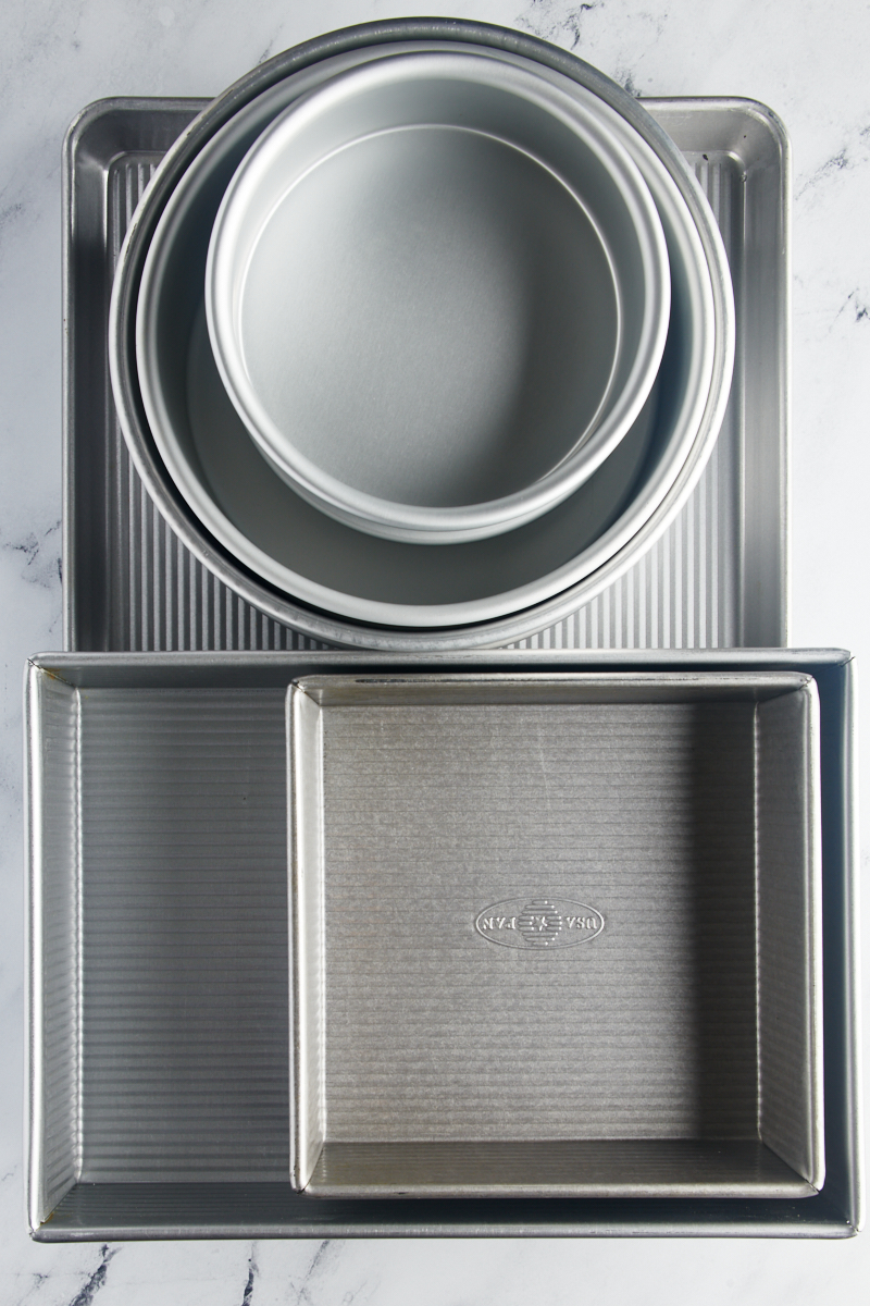 overhead view of a stack of a variety of baking pans 