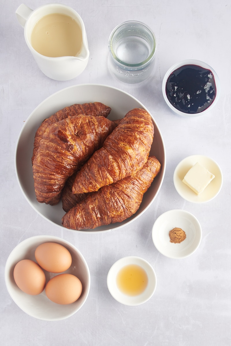 Overhead view of ingredients for blueberry croissant bread pudding