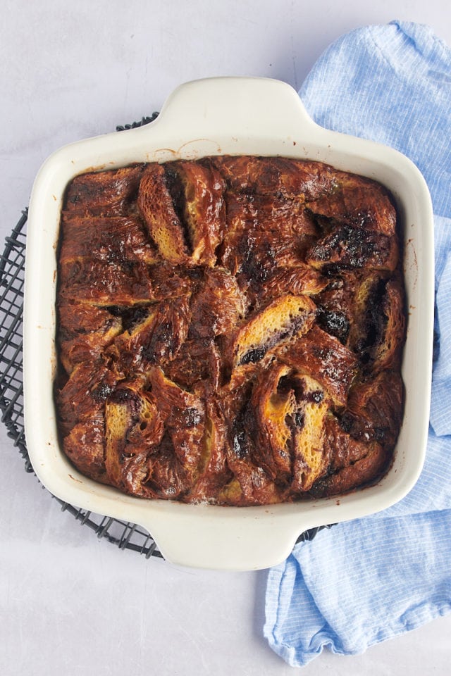 Overhead view of blueberry croissant bread pudding in baking dish