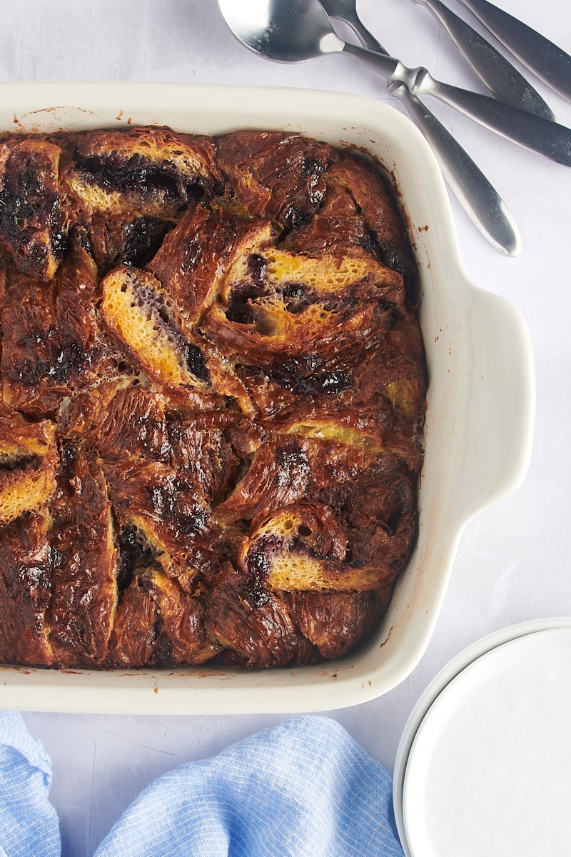 Overhead view of blueberry croissant bread pudding in baking dish