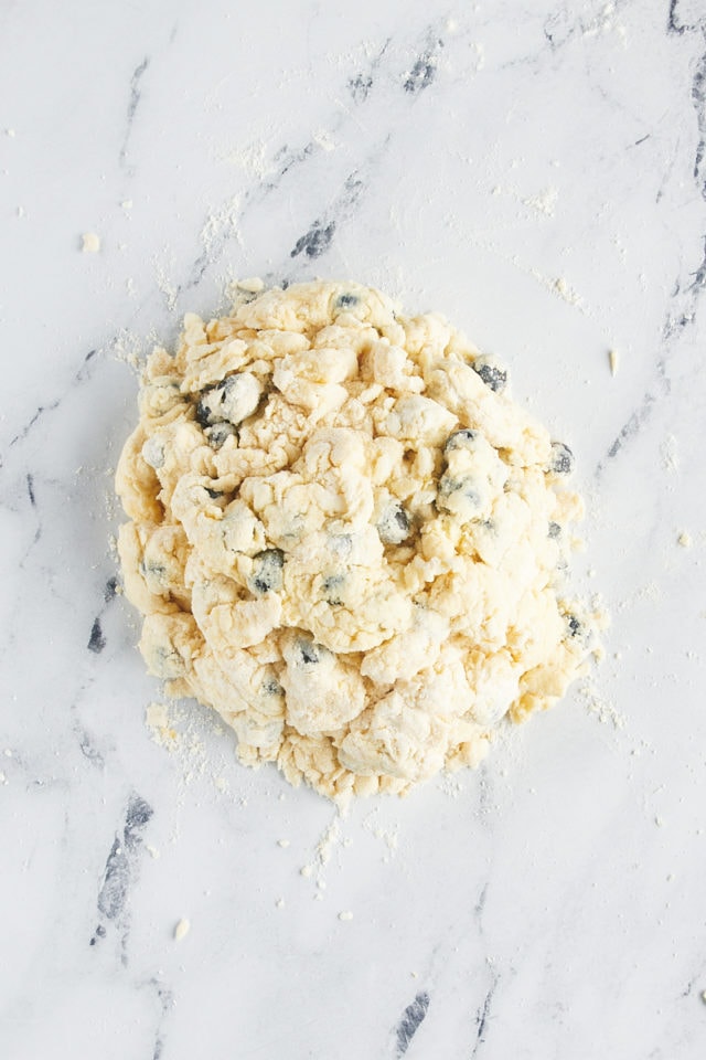 overhead view of blueberry scone dough on a lightly floured surface