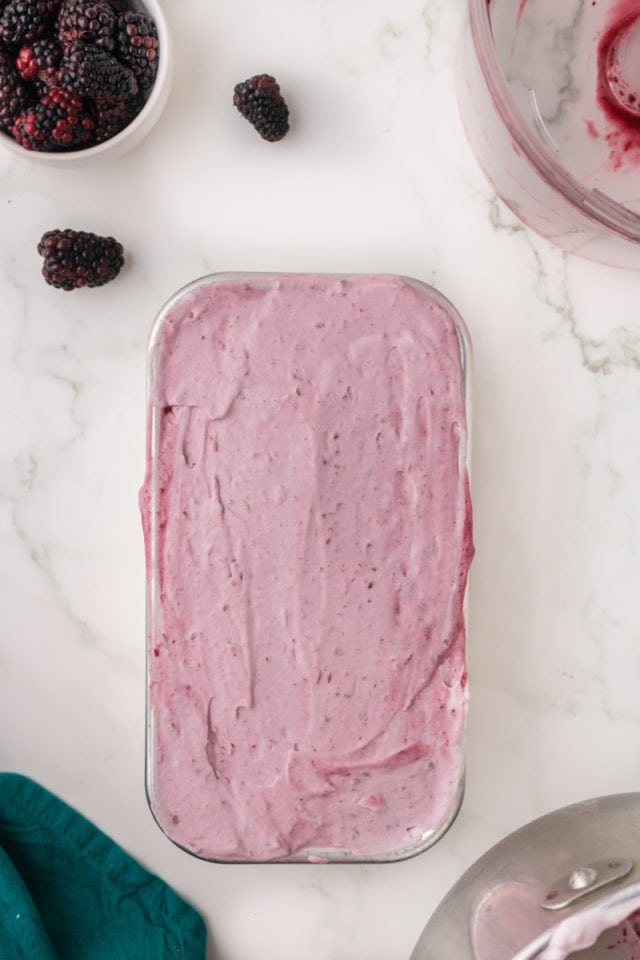 overhead view of blackberry ice cream in a metal loaf pan
