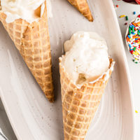 3 waffle cones of vanilla ice cream on serving platter
