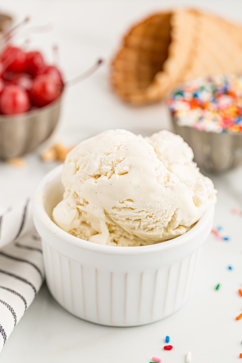 White bowl with a scoop of no-churn vanilla ice cream