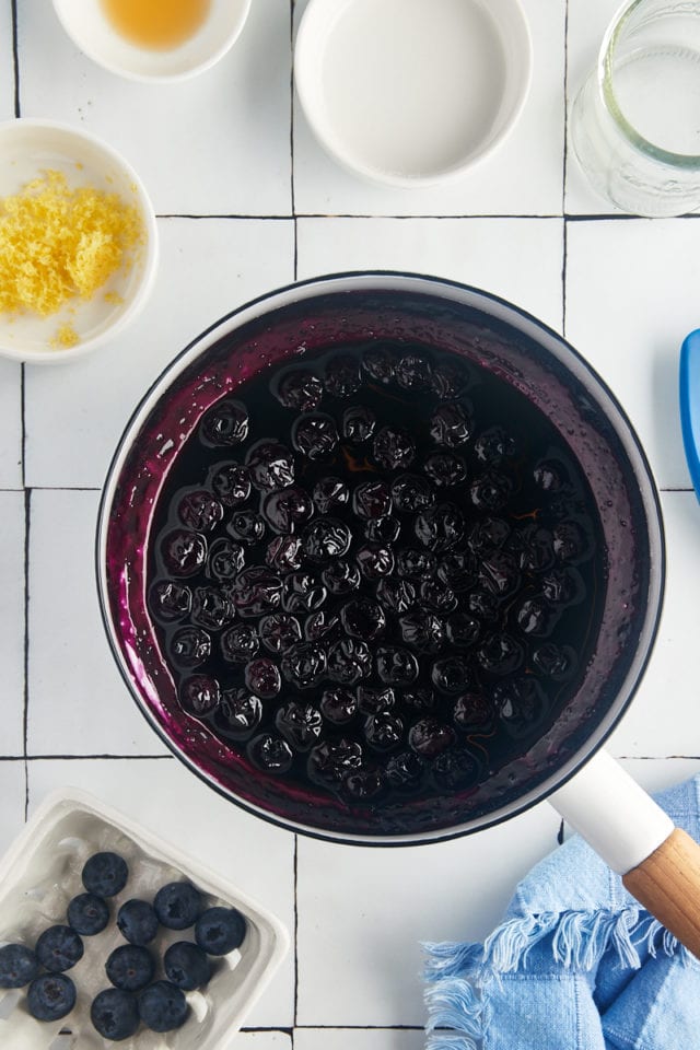overhead view of cooked blueberry compote in a saucepan