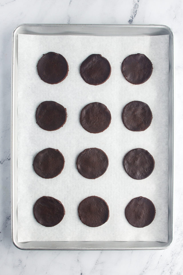 overhead view of chocolate wafer cookies on a parchment-lined baking sheet
