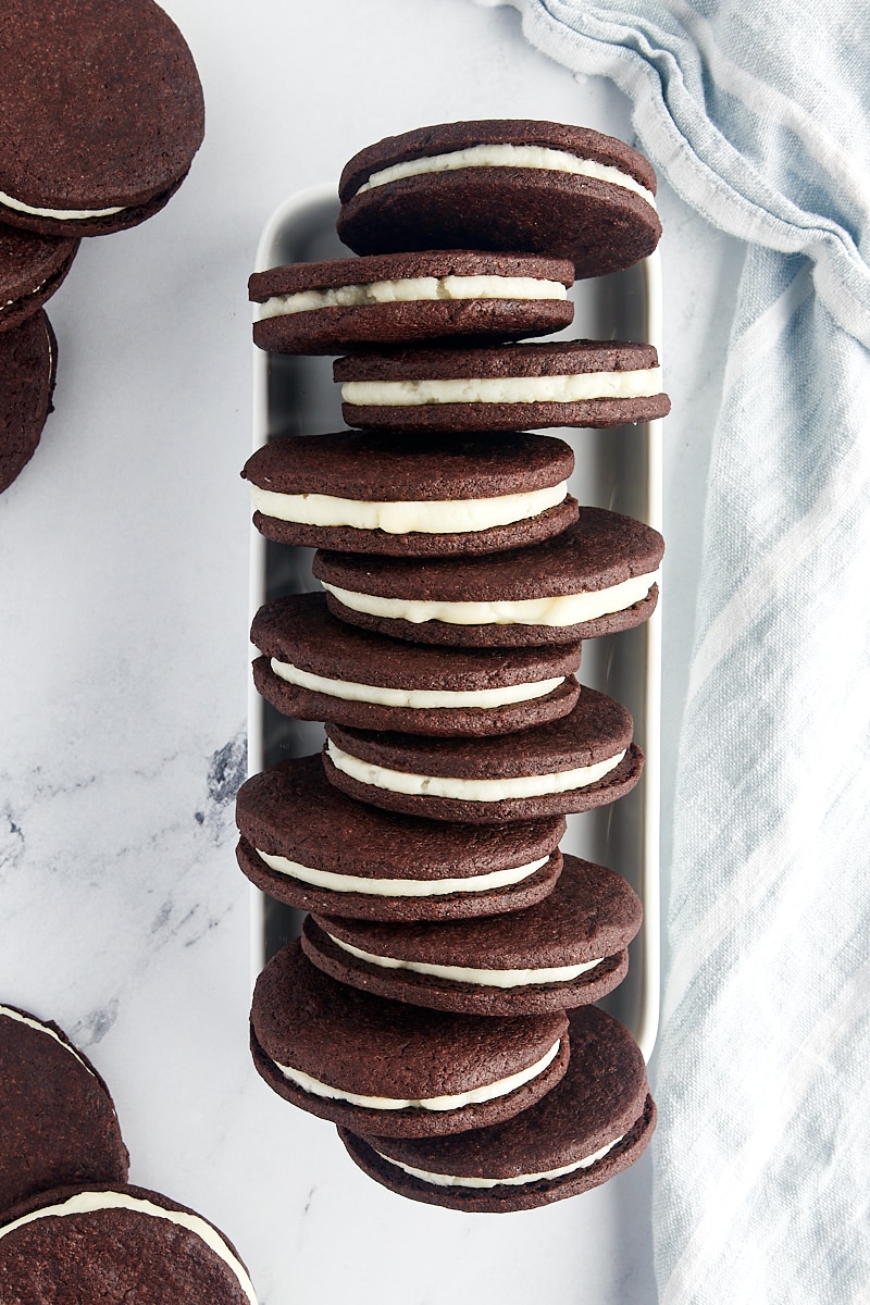 overhead view of homemade Oreos lined up in a narrow white tray