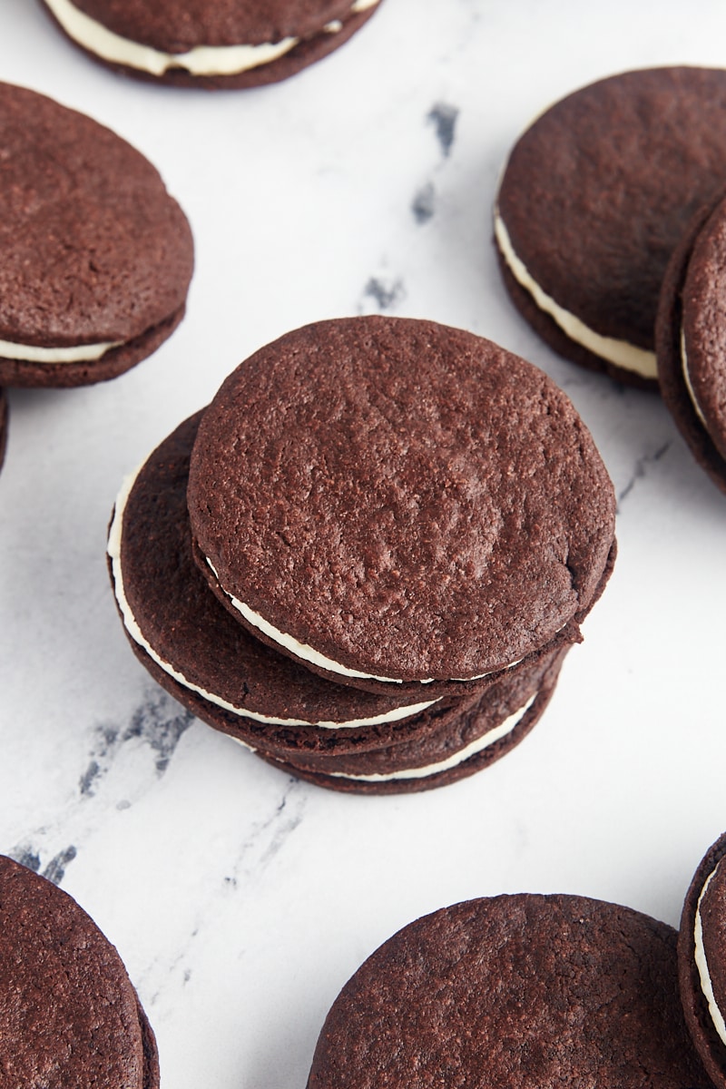 a stack of three homemade Oreos with more cookies surrounding