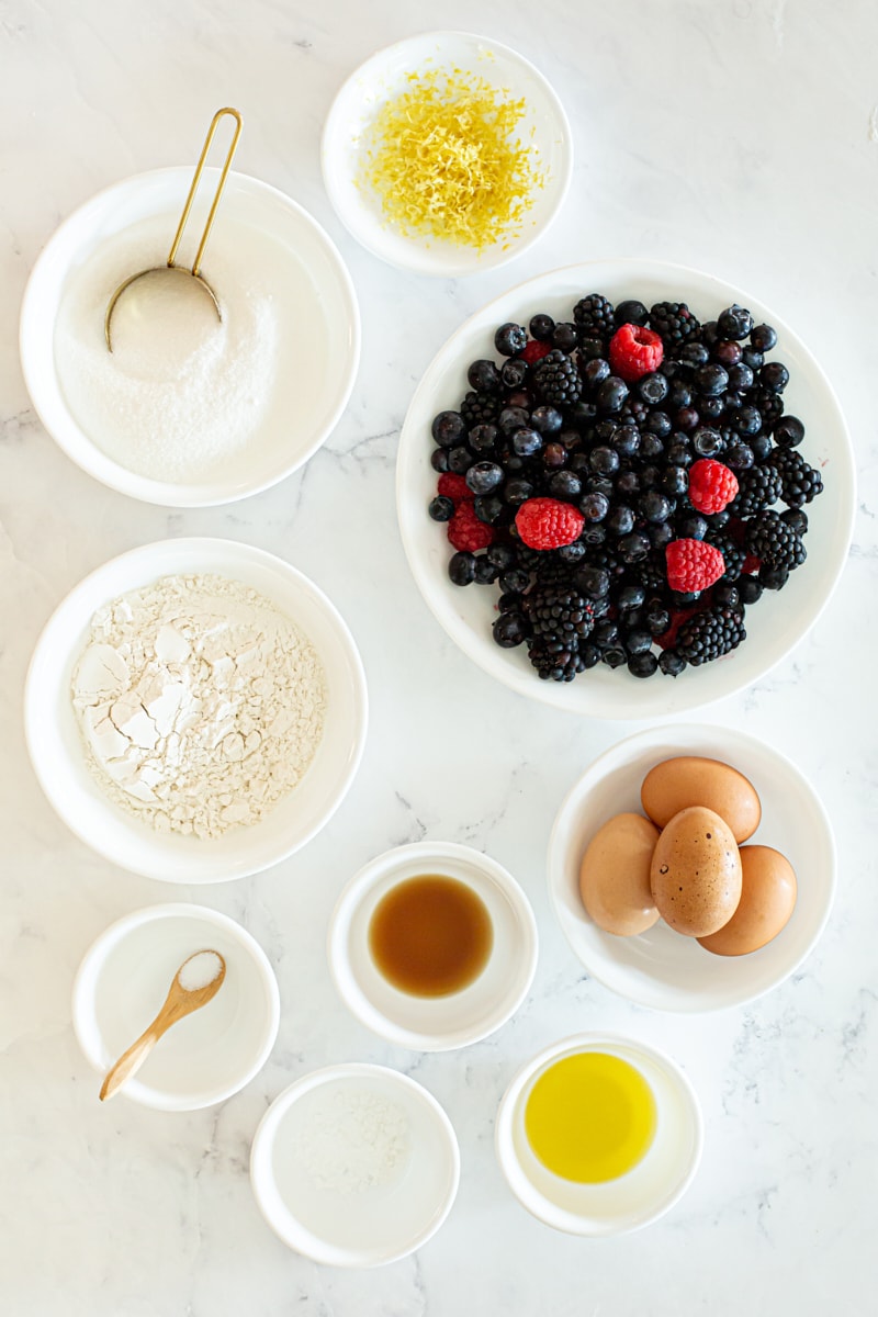 overhead view of ingredients for berry pudding cake