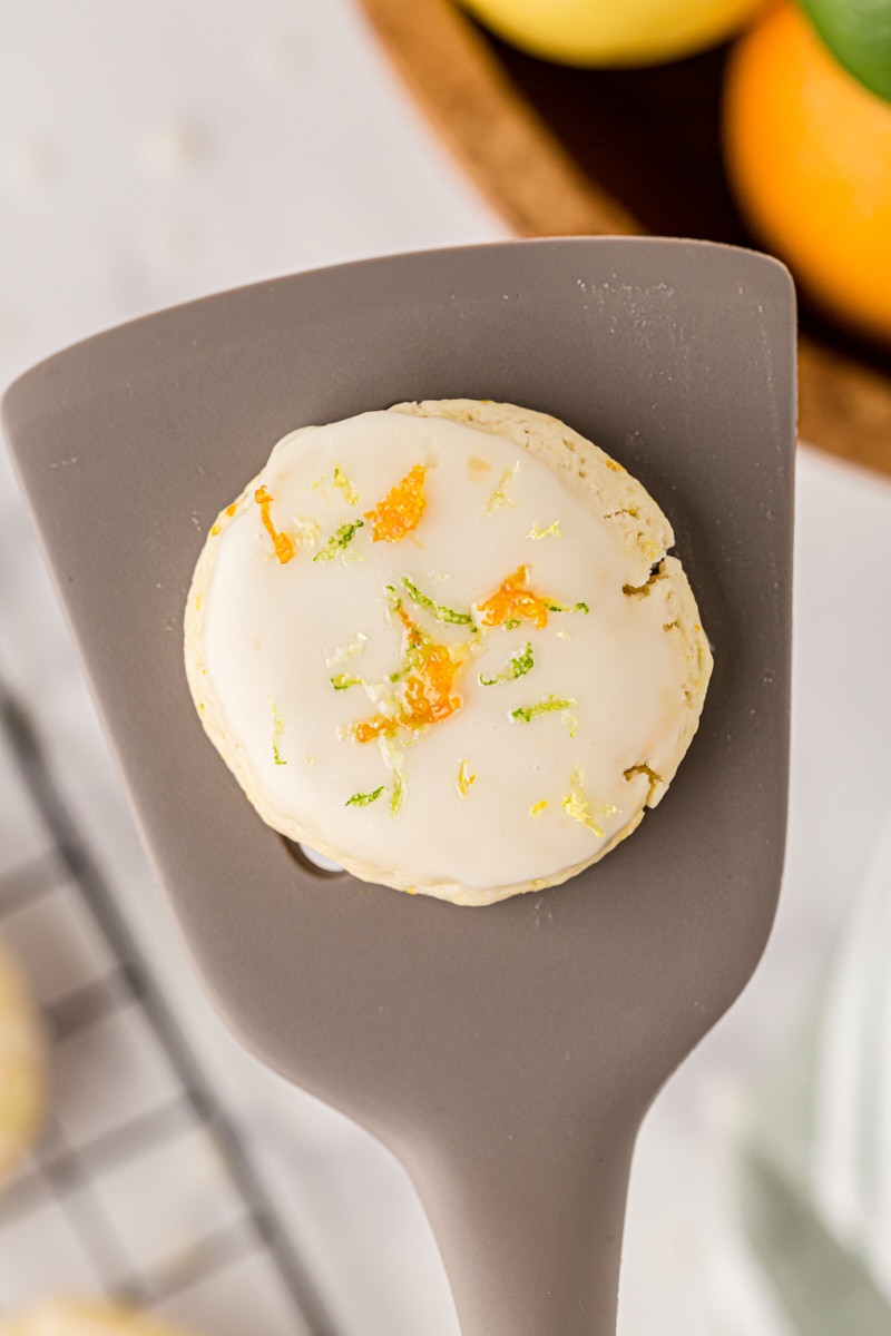 overhead view of a triple citrus cookie on a gray spatula