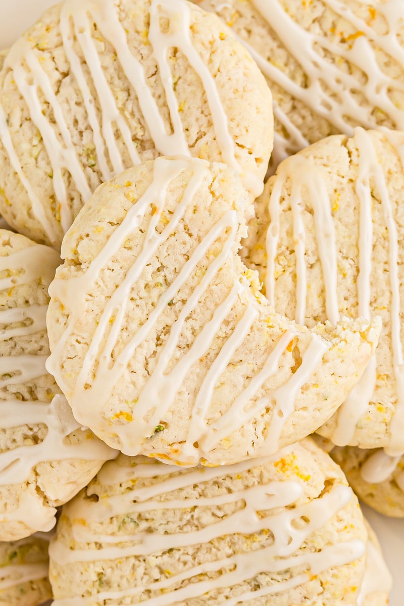overhead view of a pile of citrus cookies topped with one cookie with a bite missing