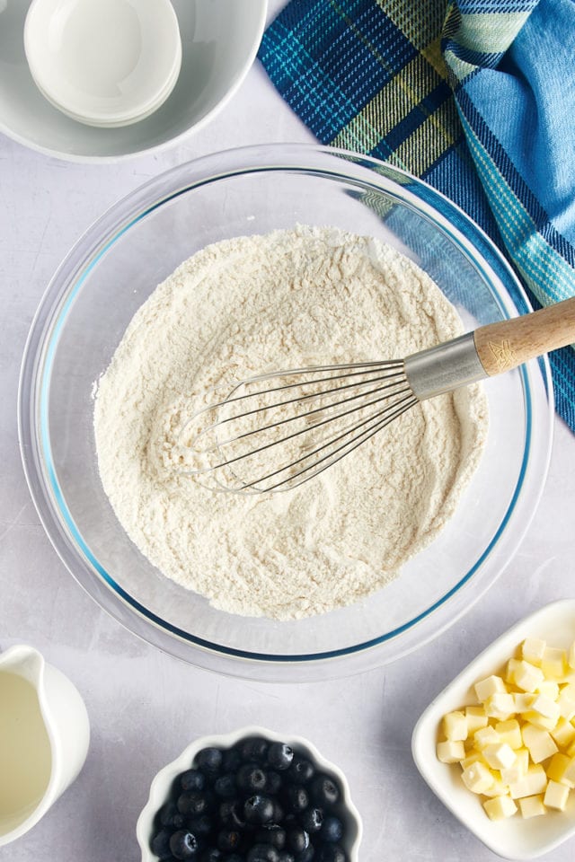 Overhead view of whisk in bowl of dry ingredients