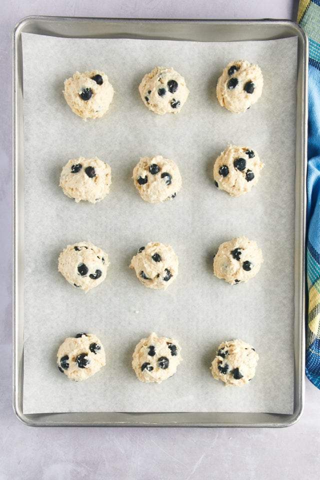 Overhead view of drop biscuit dough on baking sheet