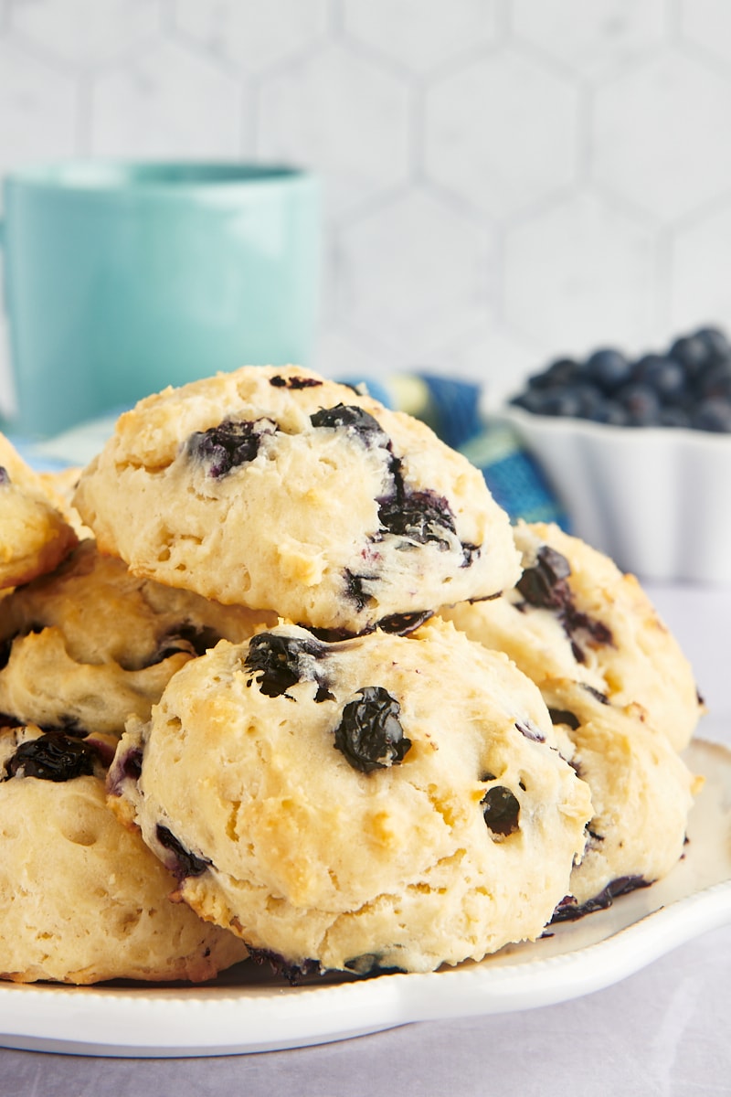 Stack of blueberry biscuits on plate