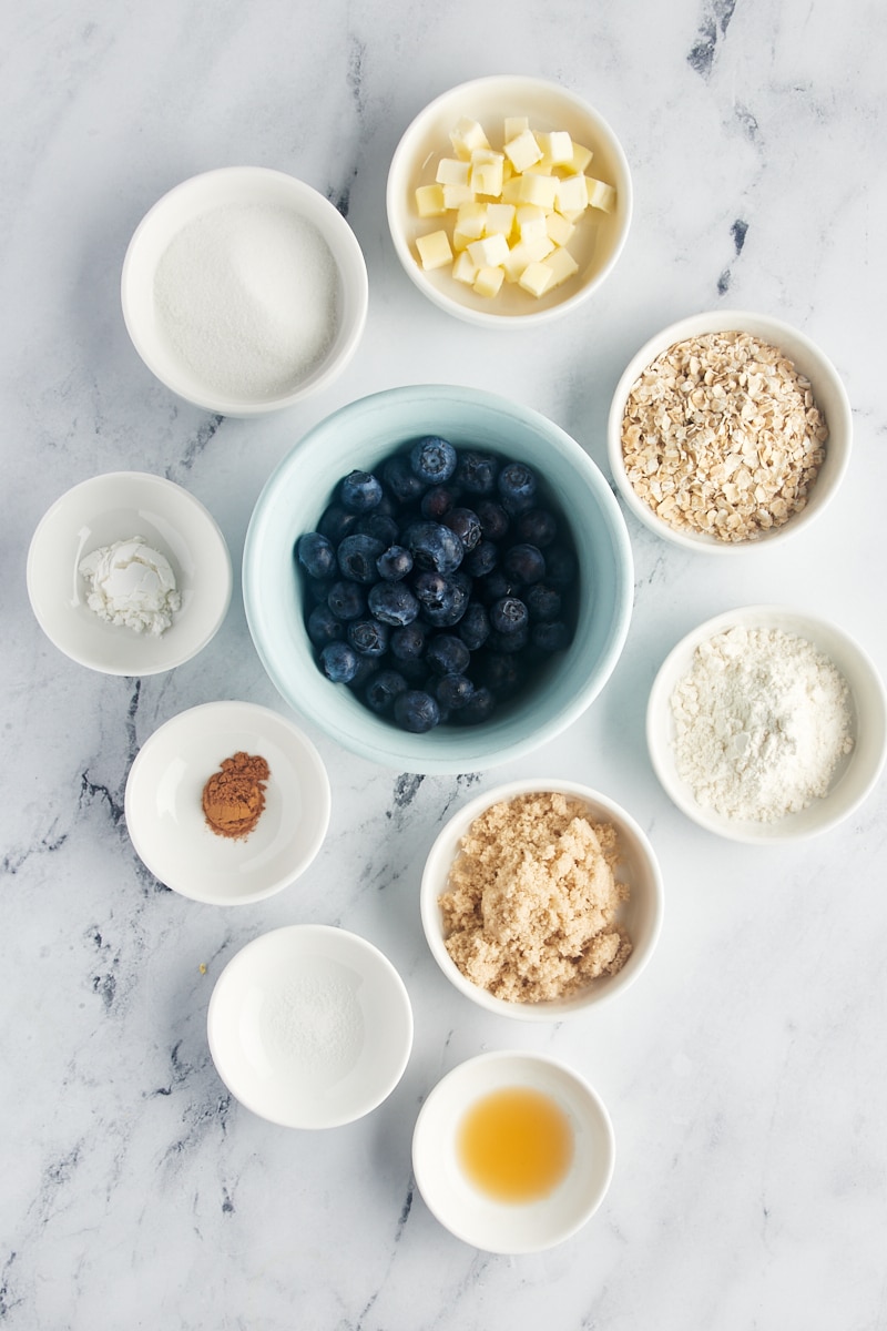 Overhead view of ingredients for blueberry crumble for two