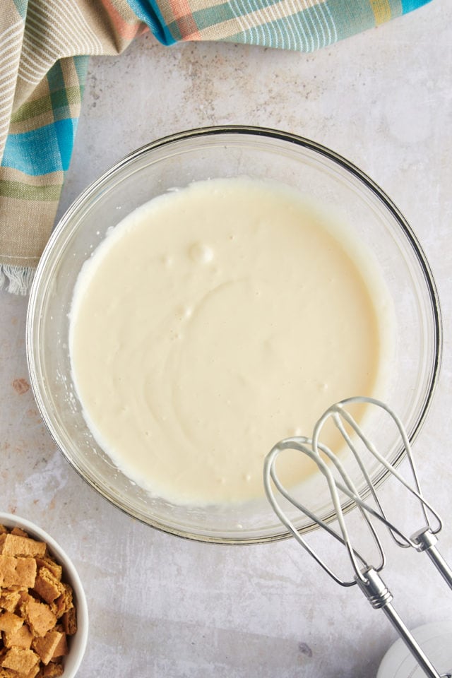 Overhead view of cream cheese mixture in mixing bowl