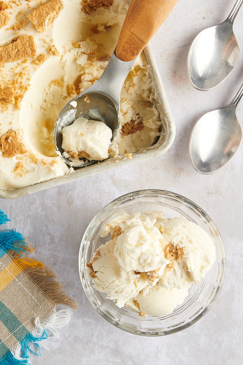 Overhead view of cheesecake ice cream in loaf pan and glass bowl