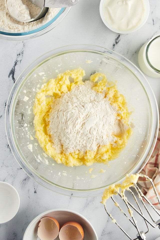 overhead view of dry ingredients added to cake batter